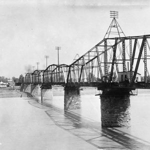 Metal bridge crossing river