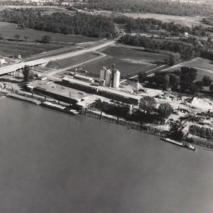 buildings and barges next to river