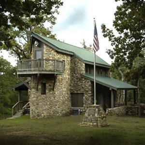 Multistory stone building with flagpole and flag