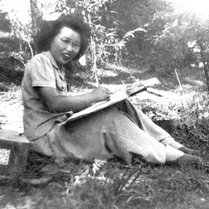 Asian woman sitting on the ground