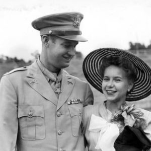 White man in military garb; white woman in hat