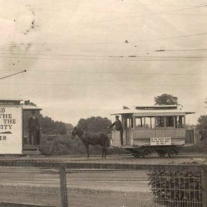 Men on two  trolleys