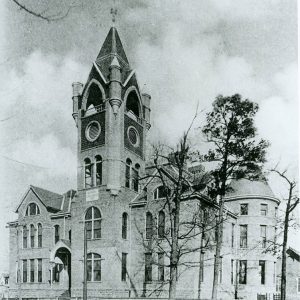 Multistory brick building with clock tower