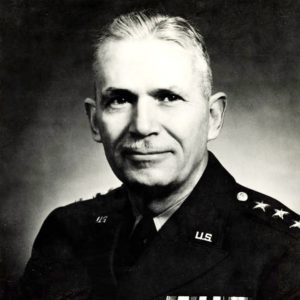 White man with mustache wearing military garb