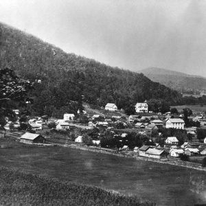 Overlooking small town set amid hills and valleys