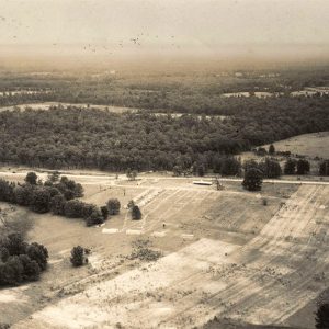 Aerial view of tent city amid trees