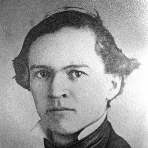 Young white man in cravat and suit