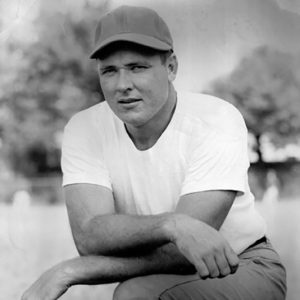 White man in cap and white t-shirt