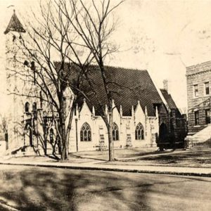 church building with steeple and adjacent multistory brick building