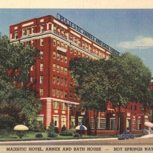 eight-story red brick building with large sign saying Majestic Annex and Bath House