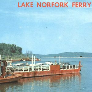 Boat on lake adjacent to ferry