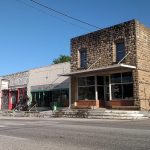 Row of rock buildings beside street