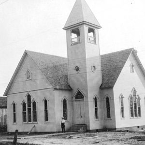 Multistory white wooden church building