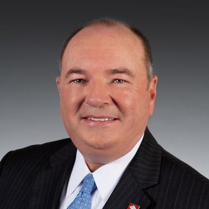 Balding white man in suit and tie