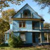 Multistory blue wooden house with several balconies