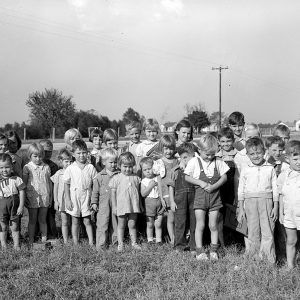 White children standing in field