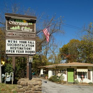 Single story buildings with large sign "Sherwood Court"