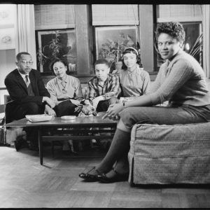 African Americans seated in living room