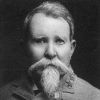 White man with beard and mustache in military garb