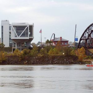 Silver building and bridge seen across river