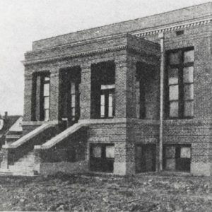 Multistory brick church building steps and columns in front