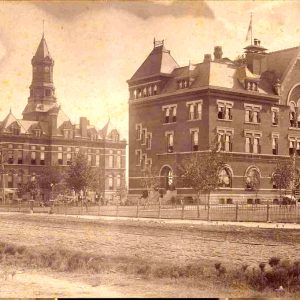 Two ornate multistory brick buildings