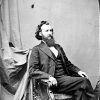 White man in suit with bushy beard