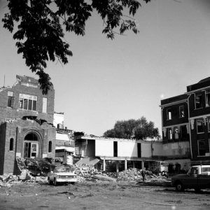 Multistory brick building being demolished