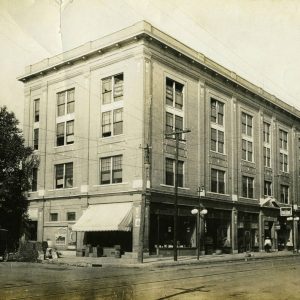 Four-story building on the corner of a city street