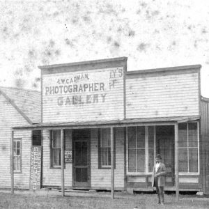 Storefront with porch "A. W. Cadman Photographer Gallery"