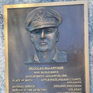 Man's face on bronze plaque