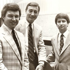 Three white men in suits and ties