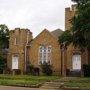 Orange brick church building with tower