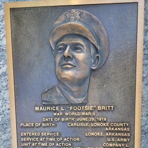 Man's face on bronze plaque