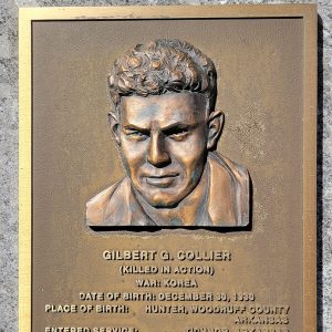 Man's face on bronze plaque