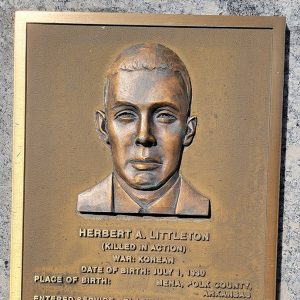 Man's face on bronze plaque