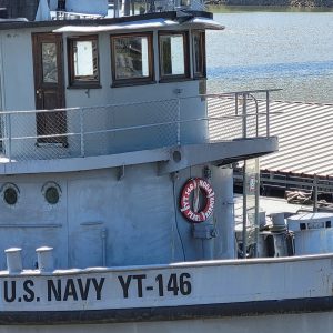 Gray boat with red life preserver