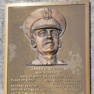 Man's face on bronze plaque