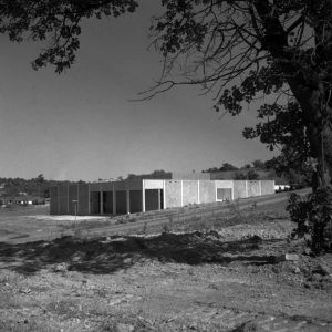 Multistory box building on side of hill