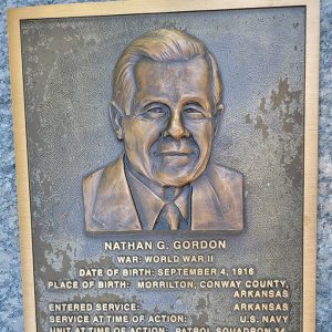 Man's face on bronze plaque