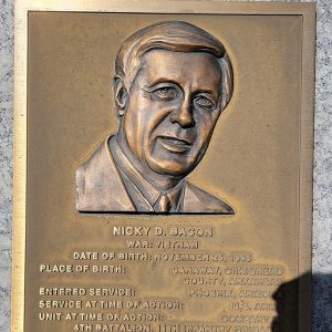 Man's face on bronze plaque