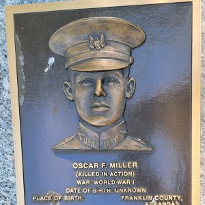 Man's face on bronze plaque