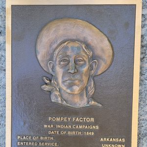 Man's face on bronze plaque