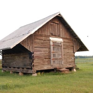 Small log structure with door and hatch