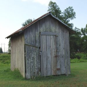 Tiny wooden building with no windows