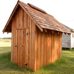 Tiny wooden building with no windows