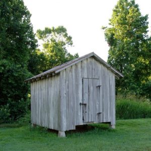 Tiny wooden building with no windows