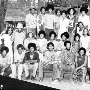 Large group of African American men and women in front of outdoor pavilion