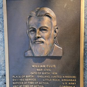 Man's face on bronze plaque