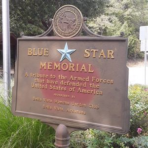 Bronze plaque saying "A tribute to the armed forces that have defended the United States of America"